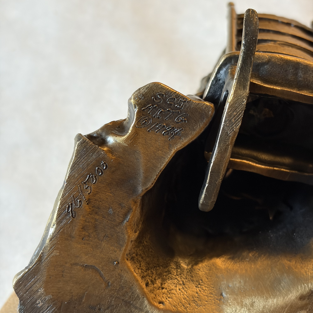 Bronze Betsy Ross Limited Edition Sculpture bottom close-up — Signed SCJ / Seward Johnson (1984) — #86/5000 on a white background