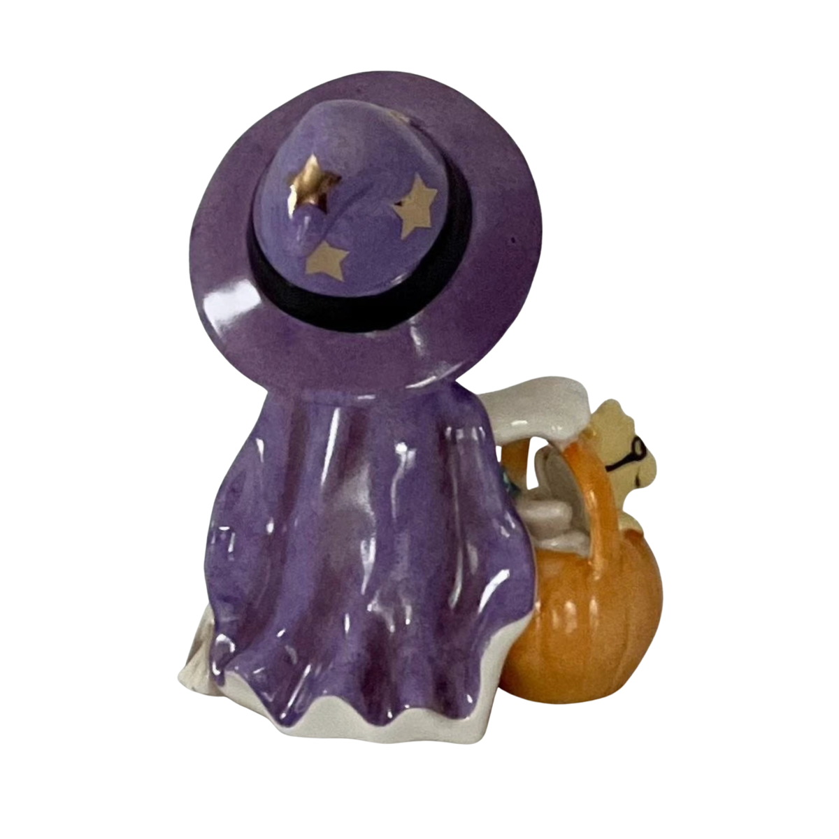 Back view of Lenox porcelain Snoopy figurine wearing a purple witch hat and cape with a pumpkin basket holding woodstock on a white background