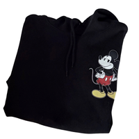 Folded Black hoodie with Mickey Mouse design on a white background