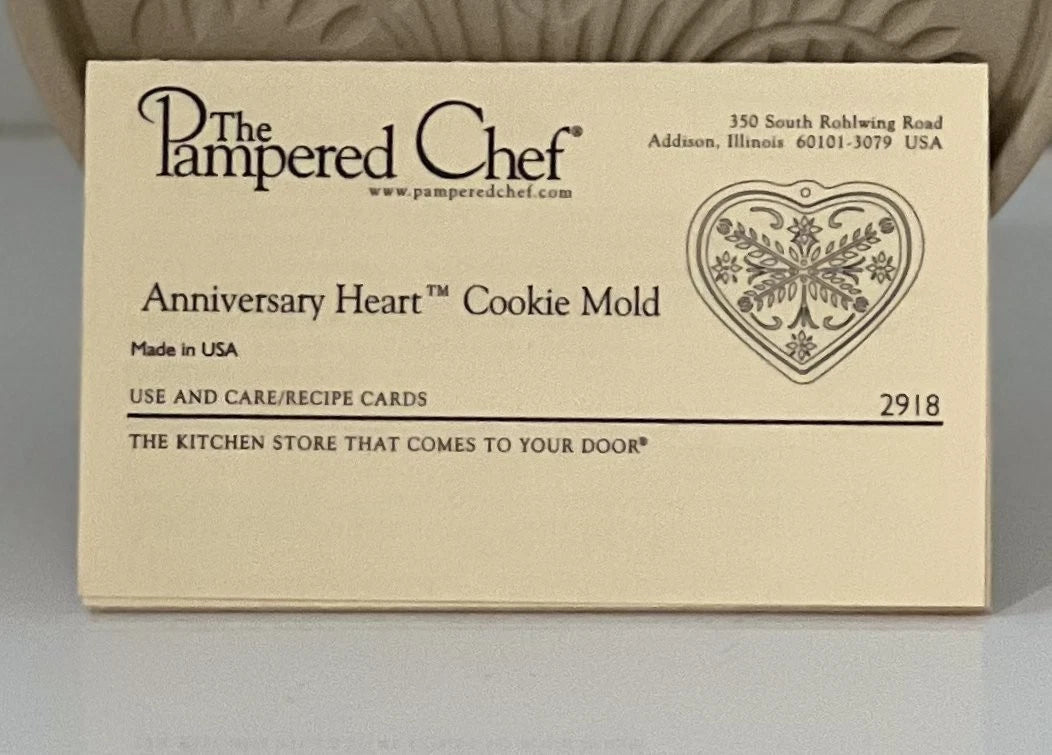 Pampered Chef stoneware cookie mold recipe cards with brand name and product details on a white and tan background