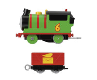 Thomas and Friends - Percy Motorized Toy Train Engine and Tender Side View. Percy is a green train engine with red stripes and has red tender. Shown on a white background