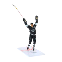 Hockey player action figure with a stick on a white background