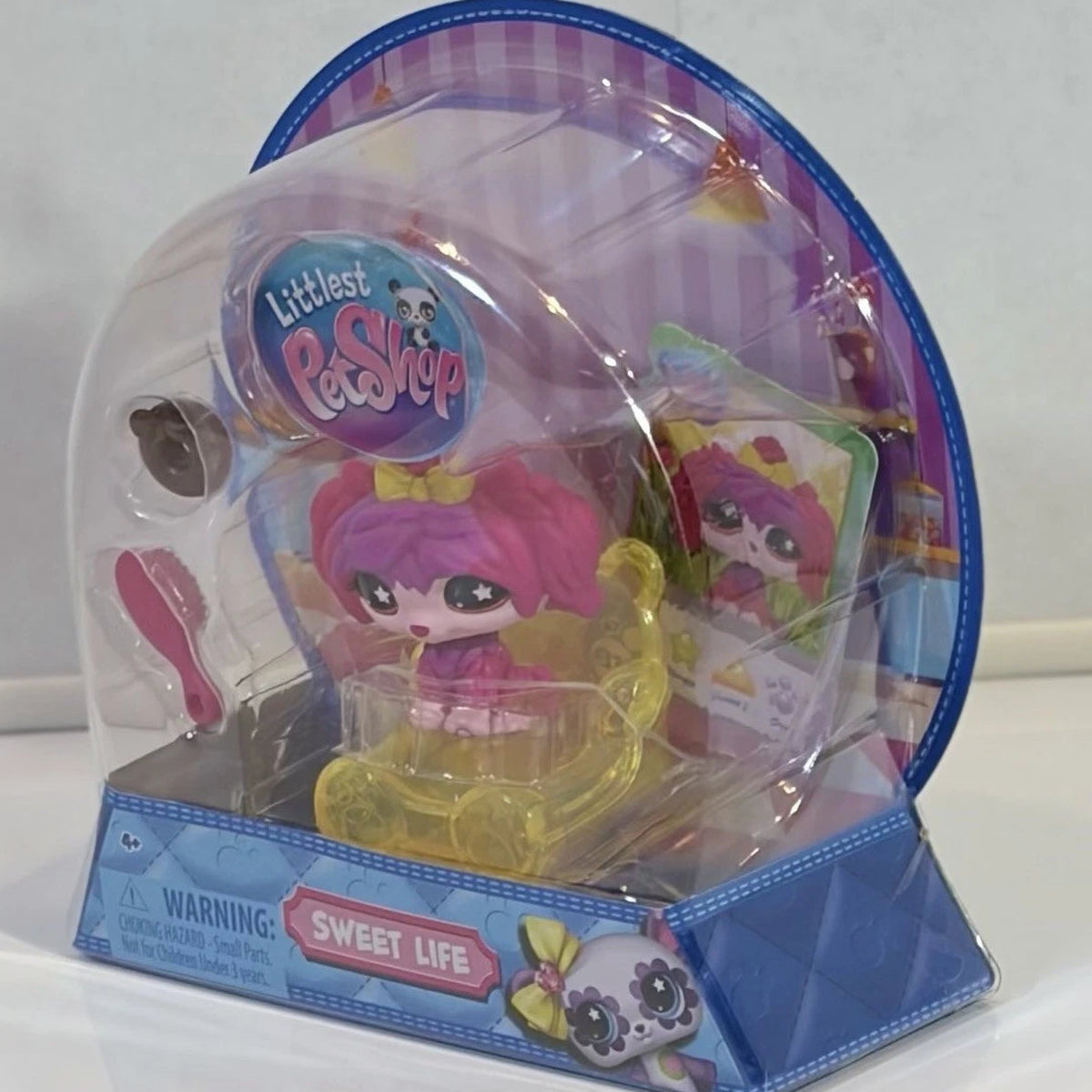 Littlest Pet Shop toy in packaging with clear dome